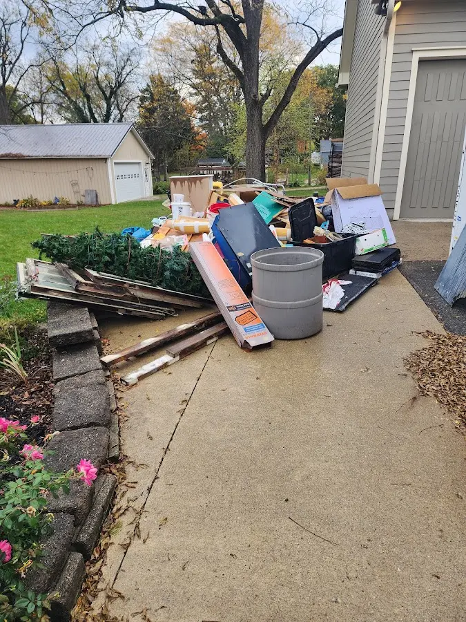 Dumpster being loaded with debris for 3 Yard Dumpster Rental in Kings Point
